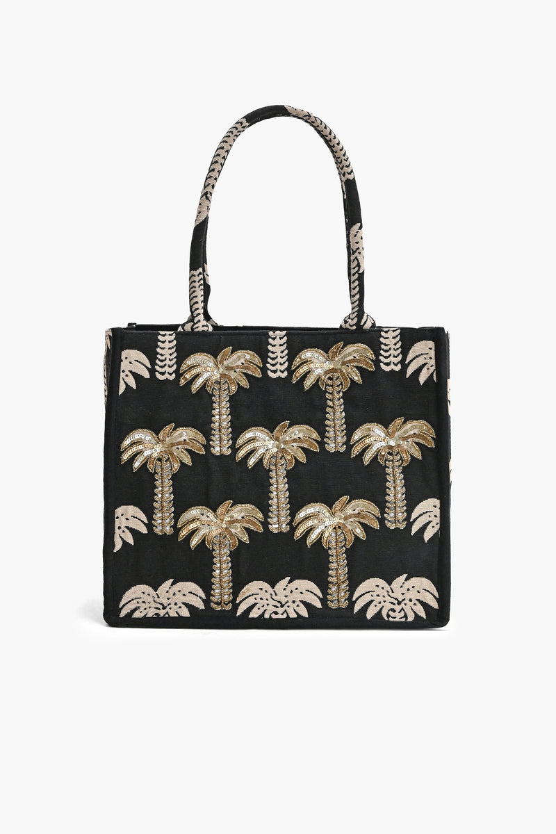 Black tote bag with gold palm tree patterns on a white background