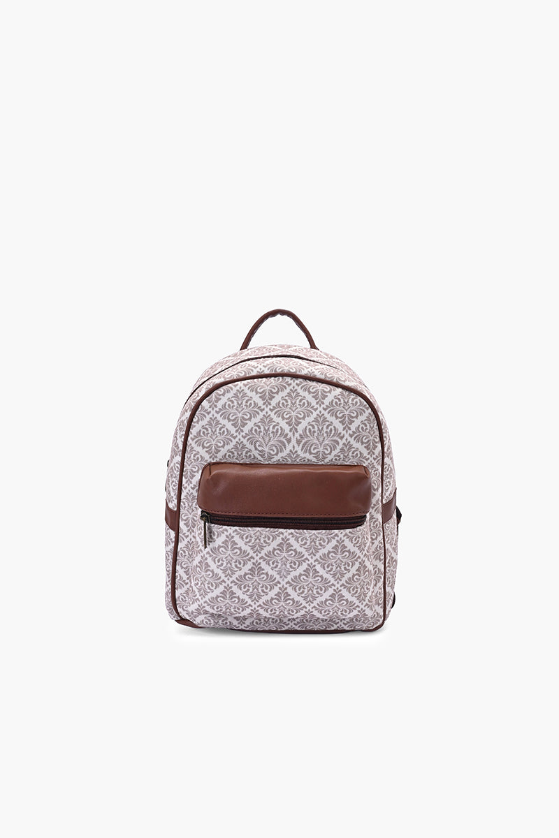 A small backpack with a light gray and white geometric pattern, featuring a solid brown front pocket and matching brown top handle, shown against a plain white background.